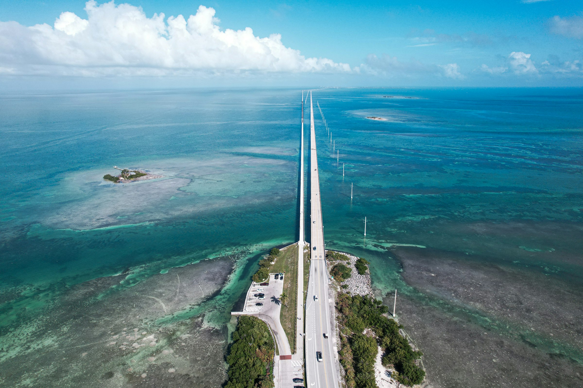Aerial view of the Overseas Highway running between shallow reef flats